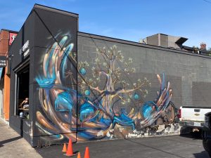 Colourful murals punctuate the Glebe’s retail strip along Bank Street. Photo by Laura Byrne Paquet.